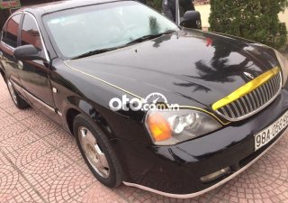 Daewoo Magnus 2004 - Cần bán xe Daewoo Magnus 2.5AT sản xuất 2004, màu đen, chính chủ