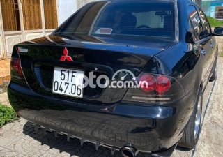 Mitsubishi Lancer 2003 - Bán ô tô Mitsubishi Lancer năm sản xuất 2003, màu đen số tự động, 185tr