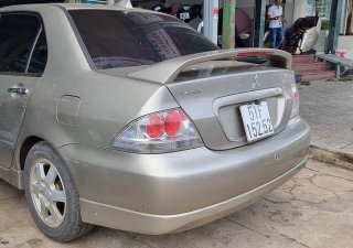 Mitsubishi Lancer 2005 - Xe màu vàng cát