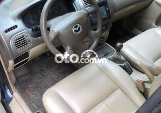 Mazda 323 .-2004 2004 - MAZDA.323-2004