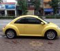 Volkswagen Beetle 2.0AT  2009 - Cần bán xe Volkswagen Beetle 2.0AT đời 2009, màu vàng