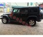 Jeep Wrangler Unlimited Sport 2010 - Cần bán gấp Jeep Wrangler Unlimited Sport 2010, màu đen, xe nhập chính chủ