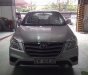 Toyota Innova E 2014 - Cần bán Toyota Innova E đời 2014, màu bạc số sàn, giá 670tr