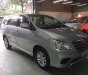 Toyota Innova E 2014 - Cần bán Toyota Innova E đời 2014, màu bạc số sàn, giá 670tr