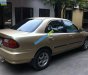 Mazda 323 1997 - Bán Mazda 323 đời 1997, màu vàng, nhập khẩu, giá 85tr