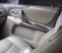 Ford Laser GHIA 1.8 MT 2004 - Cần bán gấp Ford Laser GHIA 1.8 MT năm 2004, màu đen