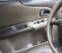 Ford Laser GHIA 1.8 MT 2004 - Cần bán gấp Ford Laser GHIA 1.8 MT năm 2004, màu đen