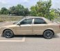 Mazda 323 Classic GLX 2003 - Chính chủ bán Mazda 323 Classic GLX đời 2003, màu vàng