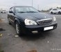 Daewoo Magnus 2.0 MT 2004 - Bán Daewoo Magnus 2.0 MT đời 2004, màu đen như mới, 178 triệu