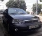 Ford Laser  Ghina 1.8 2002 - Bán Ford Laser Ghina 1.8 đời 2002, màu đen