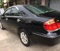 Toyota Camry G 2005 - Bán Toyota Camry G 2005, màu đen số sàn, giá chỉ 460 triệu