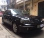 Ford Laser   Ghia 1.8 2004 - Cần bán lại xe Ford Laser Ghia 1.8 sản xuất 2004, màu đen số tự động