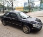 Ford Laser GHIA 1.8 AT 2004 - Cần bán lại xe Ford Laser GHIA 1.8 AT đời 2004, màu đen, giá 236tr