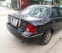 Ford Laser GHIA 1.8 AT 2004 - Cần bán lại xe Ford Laser GHIA 1.8 AT đời 2004, màu đen, giá 236tr