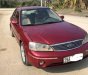 Ford Laser Ghia 1.8 MT 2003 - Cần bán lại xe Ford Laser Ghia 1.8 MT sản xuất 2003, màu đỏ