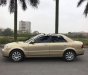 Ford Laser GHIA 1.8 AT 2004 - Cần bán gấp Ford Laser GHIA 1.8 AT năm sản xuất 2004, màu vàng số tự động, 238 triệu