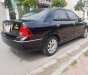 Ford Laser GHIA 1.8 AT 2004 - Bán Ford Laser GHIA 1.8 AT sản xuất năm 2004, màu đen  