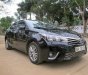 Toyota Corolla altis 2016 - Cần bán Toyota Corolla altis năm sản xuất 2016, màu đen xe gia đình, giá chỉ 690 triệu