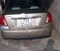 Daewoo Lacetti EX 1.6 MT 2004 - Chính chủ bán xe Daewoo Lacetti EX 1.6 MT đời 2004, màu vàng cát