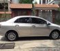 Toyota Vios 1.5E 2012 - Bán Toyota Vios 1.5E năm sản xuất 2012, màu ghi vàng, giá 325tr