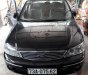 Ford Laser GHIA 1.8 AT 2005 - Bán xe Ford Laser GHIA 1.8 AT đời 2005, màu đen 