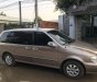 Kia Carnival 2009 - Bán Kia Carnival 2009, màu vàng  