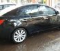 Kia Cerato 1.6 AT 2011 - Cần bán lại xe Kia Cerato 1.6 AT sản xuất năm 2011, màu đen, nhập khẩu chính chủ