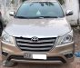 Toyota Innova 2.0E 2014 - Cần bán Toyota Innova 2.0E đời 2014, màu bạc số sàn