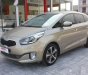 Kia Rondo   2.0 GAT 2016 - Bán Kia Rondo 2.0 GAT đời 2016, màu vàng cát