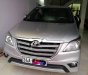 Toyota Innova 2.0E 2014 - Cần bán gấp Toyota Innova 2.0E đời 2014, màu bạc xe gia đình