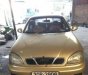 Daewoo Lanos SX 2002 - Bán Daewoo Lanos SX năm 2002, màu vàng cát