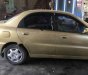 Daewoo Lanos SX 2002 - Bán Daewoo Lanos SX năm 2002, màu vàng cát