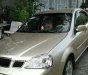 Daewoo Lacetti 2004 - Cần lên 7 chỗ bán Daewoo Lacetti đời 2004, màu vàng