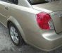 Daewoo Lacetti 2004 - Cần lên 7 chỗ bán Daewoo Lacetti đời 2004, màu vàng