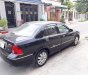 Ford Laser Ghia  2006 - Bán ô tô Ford Laser đời 2006, màu đen số tự động, 228tr
