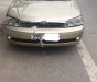 Ford Laser GHIA 1.8 MT 2002 - Chính chủ bán xe Ford Laser GHIA 1.8 MT đời 2002, màu vàng