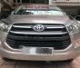 Toyota Innova 2.0E 2016 - Cần bán lại xe Toyota Innova 2.0E sản xuất năm 2016, màu nâu số sàn