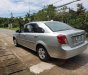 Daewoo Lacetti 2011 - Bán Daewoo Lacetti sản xuất 2011, màu bạc xe gia đình