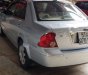 Ford Laser GHIA 1.8 AT 2004 - Bán Ford Laser 1.8L AT đời 2004, màu bạc 