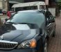 Daewoo Magnus 2004 - Cần bán gấp Daewoo Magnus đời 2004, màu đen chính chủ