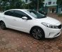 Kia Cerato 1.6 2018 - Bán xe Kia Cerato 1.6 AT màu trắng sản xuất 2018 đăng ký 04/2018