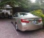 Toyota Camry  2.0 E   2014 - Bán Toyota Camry 2.0 E năm sản xuất 2014, màu vàng  