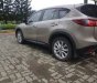 Mazda CX 5   2015 - Cần bán Mazda CX 5 sản xuất 2015, màu vàng còn mới, giá chỉ 760 triệu