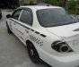Kia Spectra   2004 - Cần bán Kia Spectra năm 2004, màu trắng, xe đẹp, chạy êm ổn định
