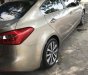 Kia K3 2.0 2014 - Bán xe Kia K3 2.0 năm 2014, màu vàng