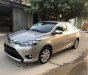 Toyota Vios  E 1.5MT  2014 - Bán Toyota Vios E số sàn năm sản xuất 2014, màu vàng