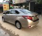 Toyota Vios  E 1.5MT  2014 - Bán Toyota Vios E số sàn năm sản xuất 2014, màu vàng