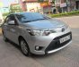 Toyota Vios 1.5E 2015 - Bán Toyota Vios 1.5E năm 2015, màu bạc số sàn