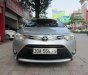 Toyota Vios 1.5E 2015 - Bán Toyota Vios 1.5E năm 2015, màu bạc số sàn