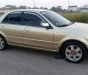 Ford Laser  1.8MT 2003 - Cần bán Ford Laser 1.8MT năm 2003, màu vàng chính chủ giá cạnh tranh